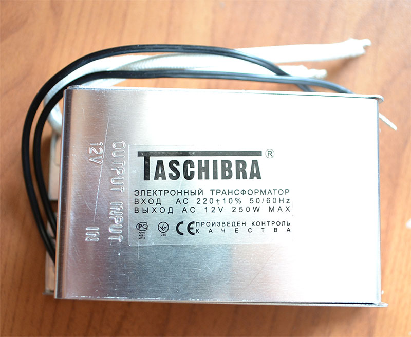 Трансформатор электронный 12v. Taschibra электронный трансформатор 12v 60w. Трансформатор электронный Taschibra 220/12 250 Вт. Трансформатор электронный понижающий 230v/12v 150w tra25 Taschibra. Трансформатор Taschibra 220 на 12 вольт.